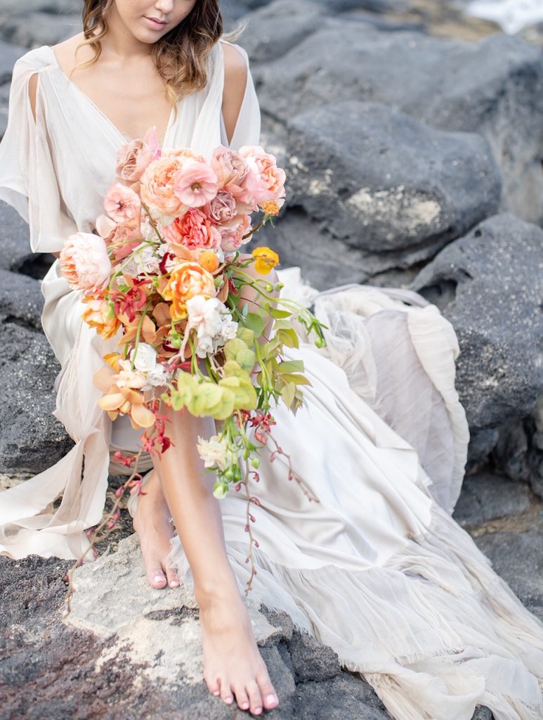 tropical bridal bouquet on Hawaii lava rocks