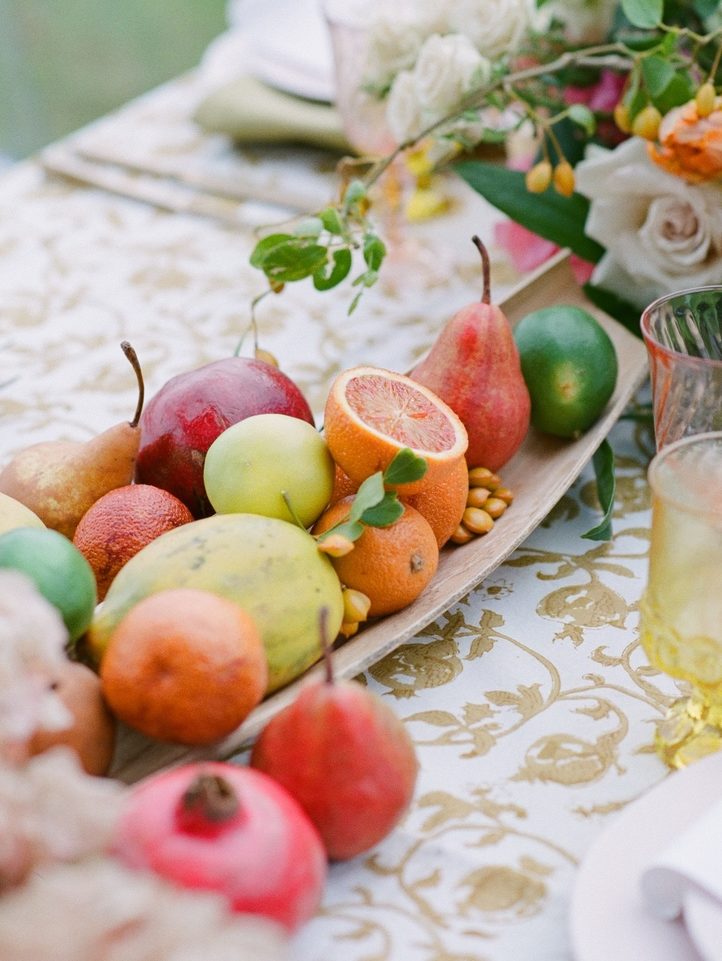 Tropical fruit wedding reception table decor