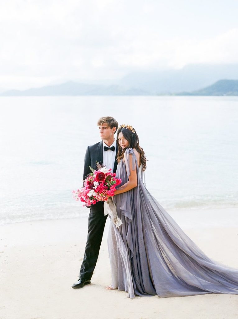 Hawaii beach wedding with hot pink bridal bouquet kualoa ranch wedding